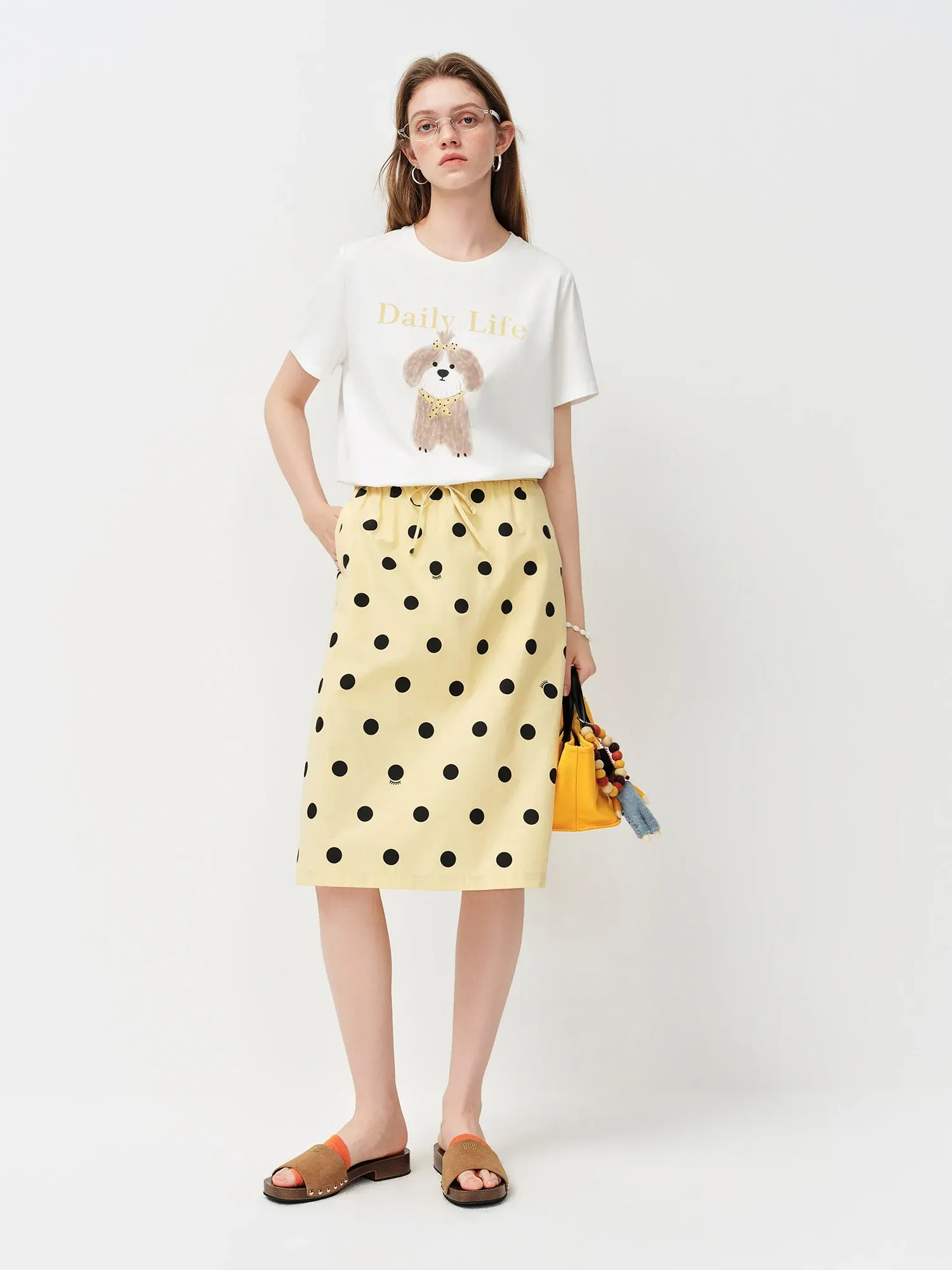 Jupe trapèze à pois en coton, taille empire et longueur genou